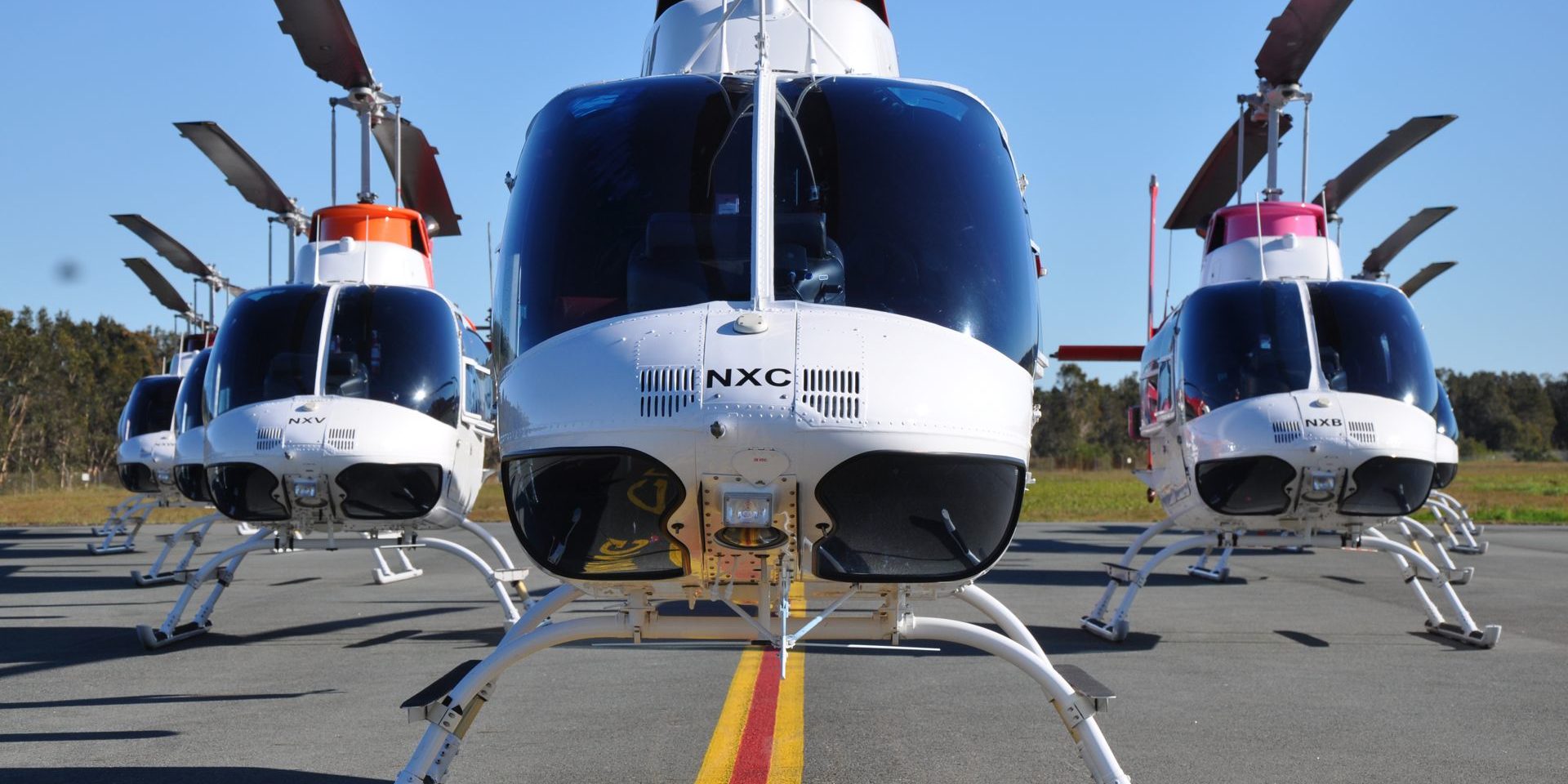 Front view of the B206BIII Jet Ranger fleet in formation