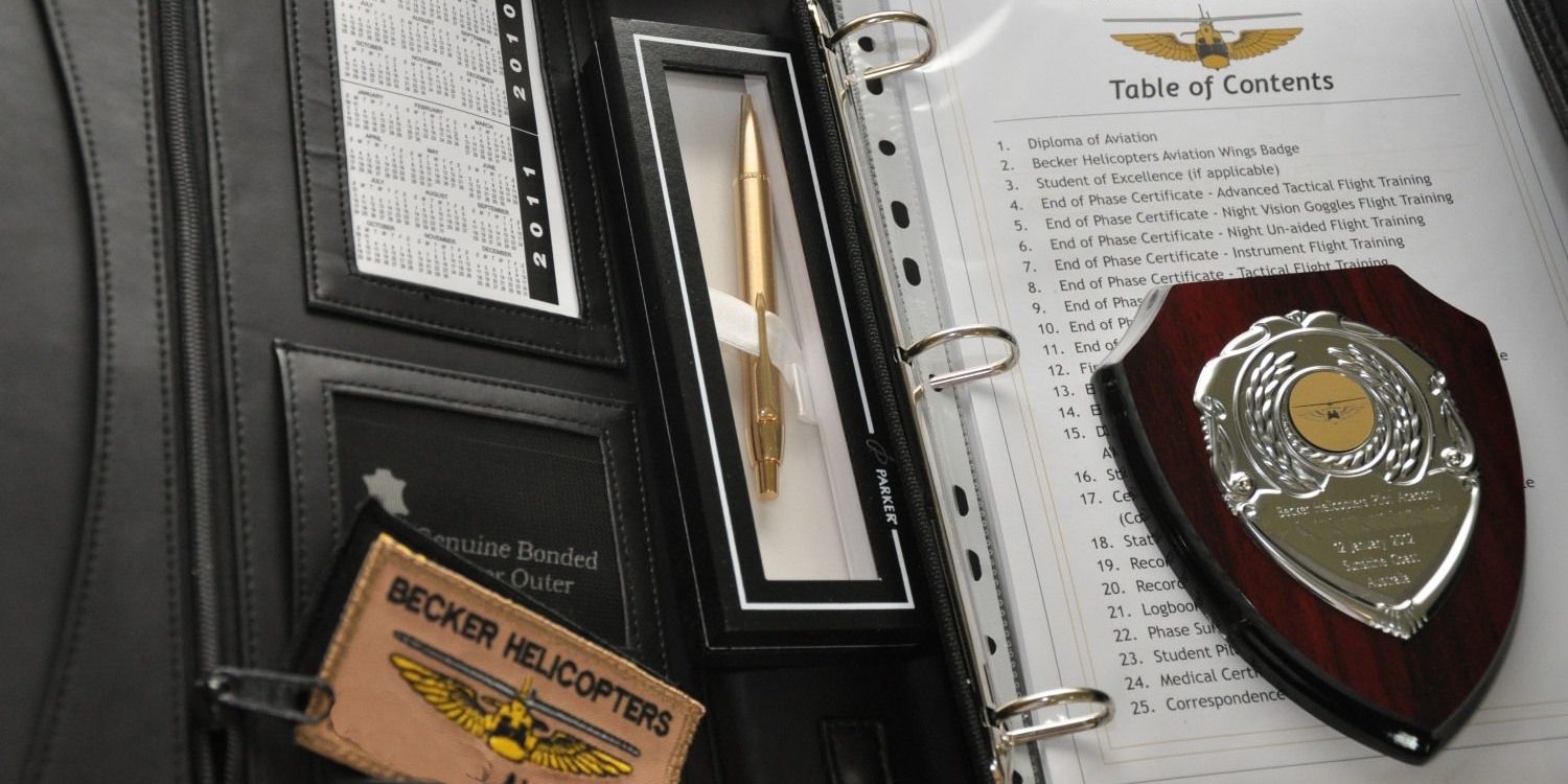 Graduation Folder showing Certificates received on completion of the Initial Entry Rotary Wing Pilot Program