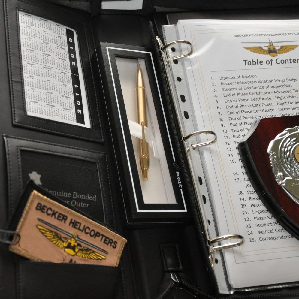 Graduation Folder showing Certificates received on completion of the Initial Entry Rotary Wing Pilot Program