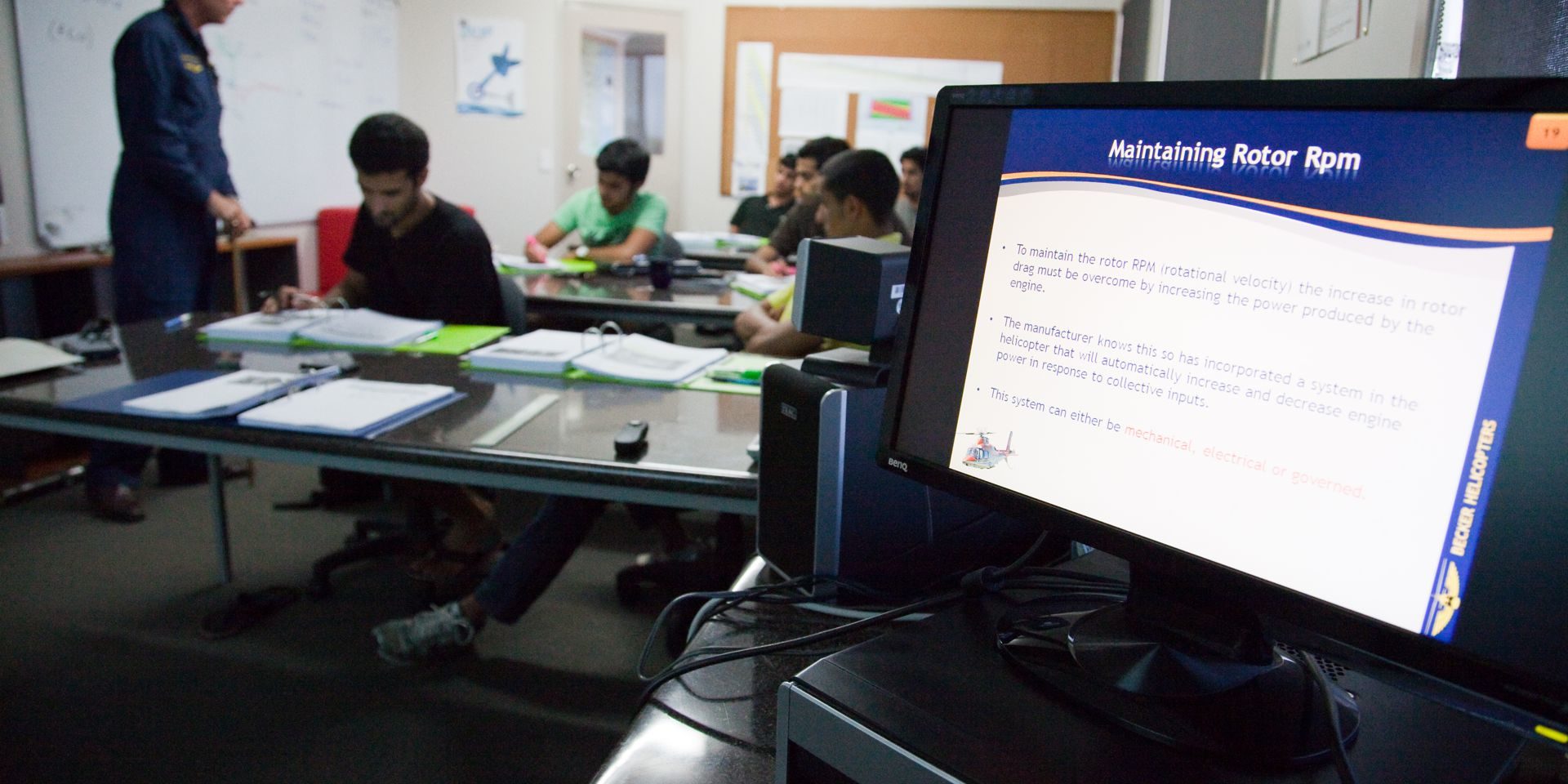 Pilot trainees studying in a classroom